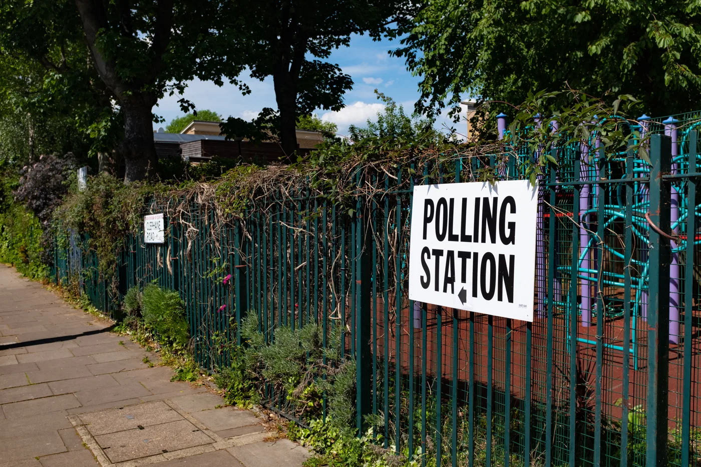 A polling station sign on a railing. The picture was not taken in Abingdon.